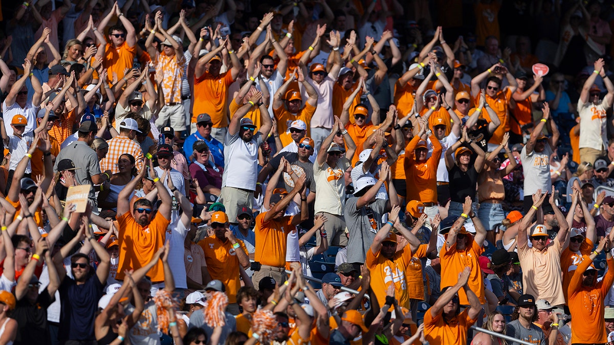 Peyton Manning, Morgan Wallen hug after Tennessee hits home run to start deciding College World Series game