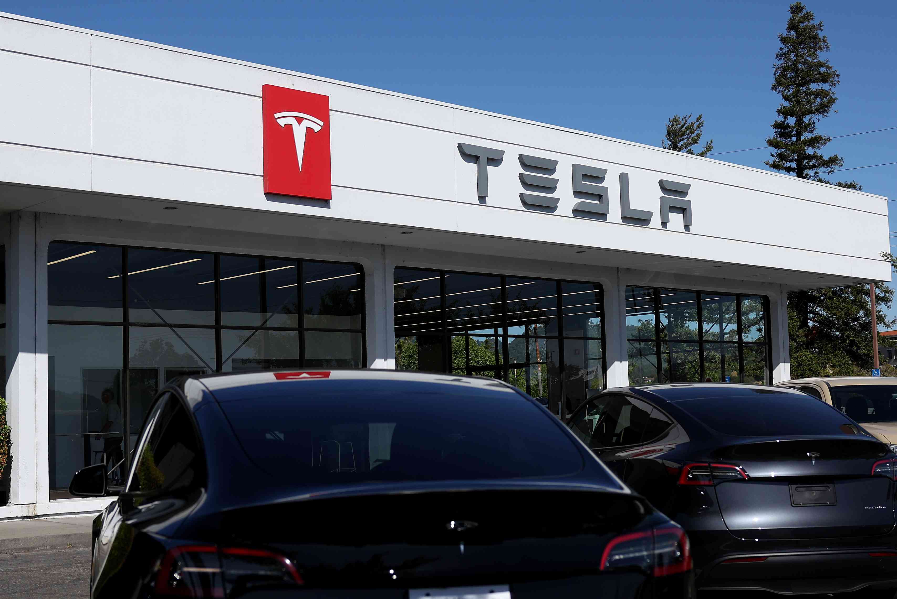 Macy’s, Tesla, Coinbase Global, and More