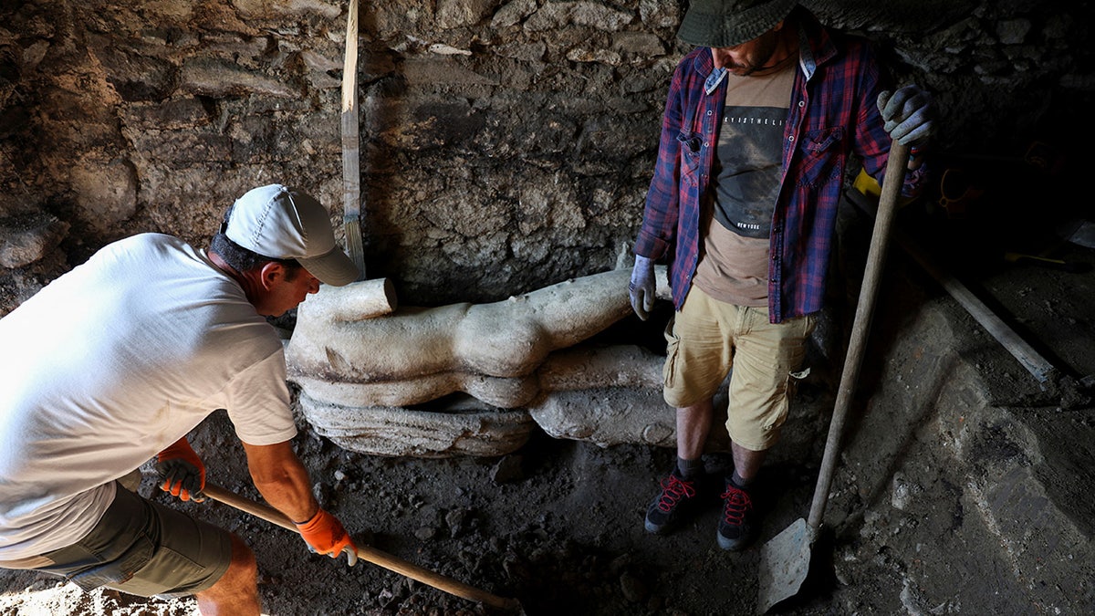 Statue of Greek god uncovered by archaeologists during excavation of ancient Roman sewer in Bulgaria
