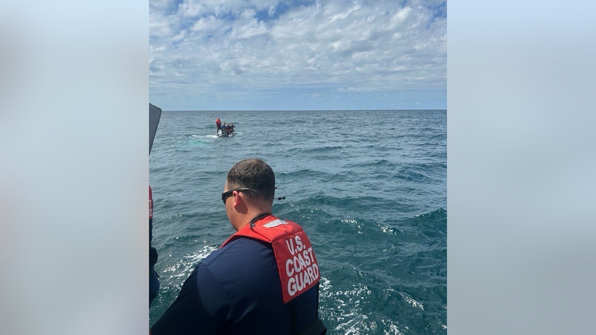 Coast Guard rescues 5 men huddled atop capsized boat 11 miles off Florida coast